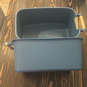 Two blue plastic storage bins.